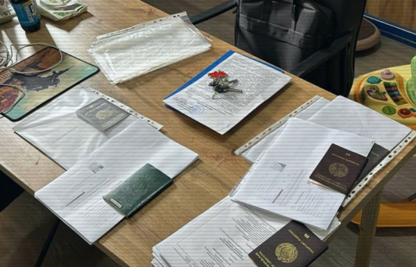 Десятки паспортов и оружие: громкое дело в Шымкенте